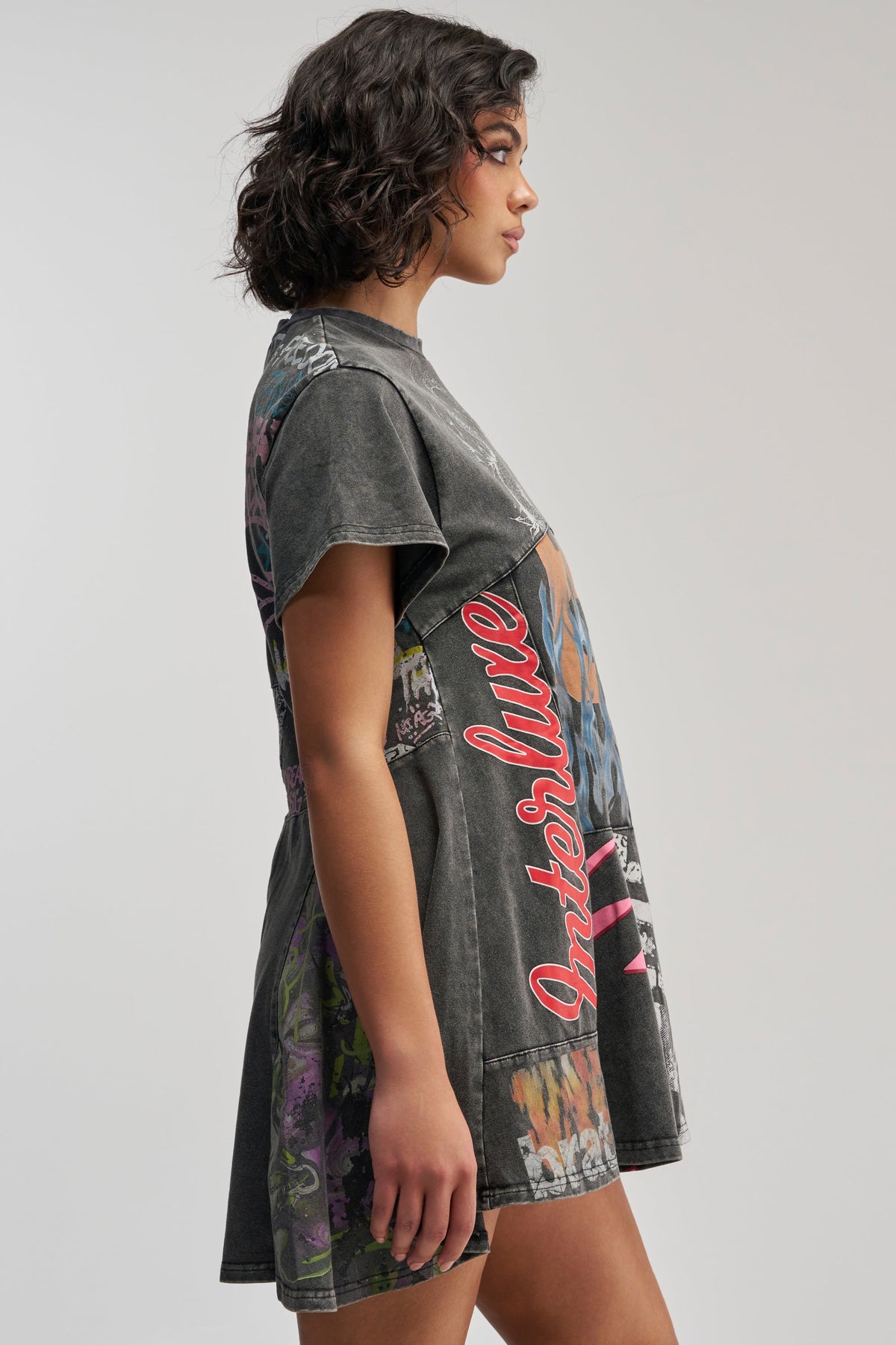 COLD HEARTED GRAPHIC MINI DRESS IN BLACK MULTI